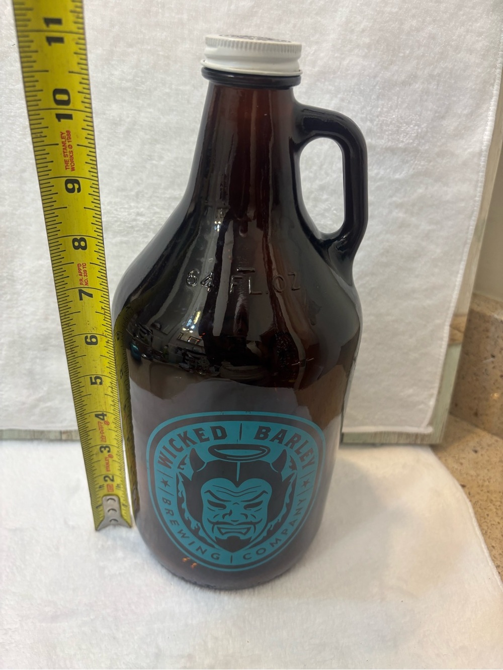 Vintage 64-ounce amber glass growler